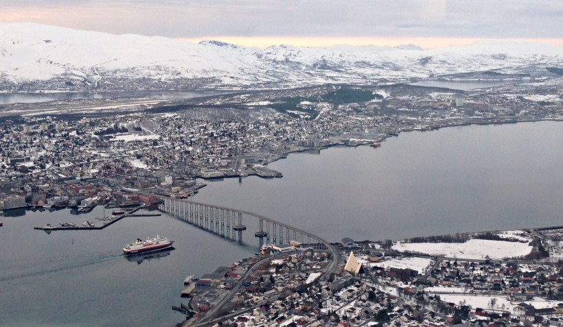 The Hurtigruten ship leaving Tromsø in the evening, to continue the cruise. This photo was taken as we were waiting for the sunset on the Fjellheiser Storsteinen mountain viewpoint above the city.
